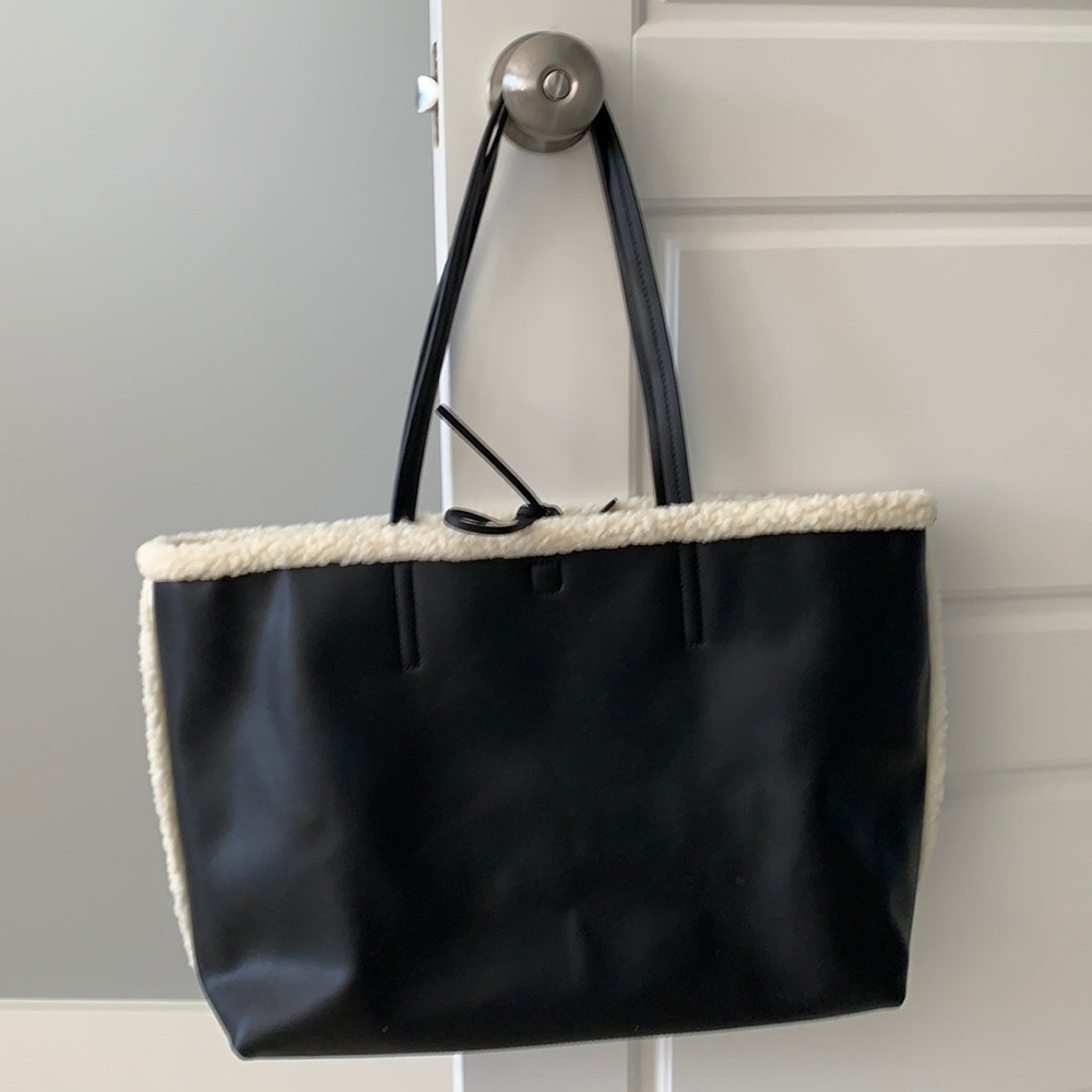 Faux Black Leather Handbag with Faux Sherpa Interior with Black Toe Closure.